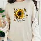Natural graphic tee with gold sunflower design and “Be the Sunshine” inspirational message