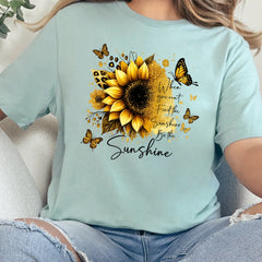 Dusty Blue graphic tee with sunflower and butterfly design featuring uplifting quote