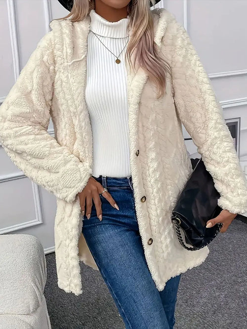 Front view of cream button-front teddy coat styled with jeans and a white sweater