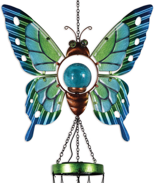 Close-up of handcrafted solar butterfly wind chime with glass and metal details for porch or garden decor.