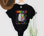 Black t-shirt with colorful brain graphic and 'Embrace Neurodiversity' text on a white background.
