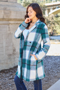 Woman wearing a plaid coat in an outdoor setting