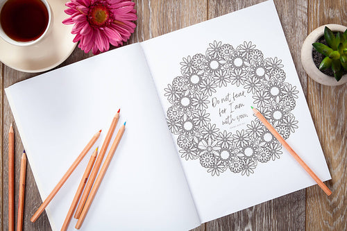 Inside page of God's Words for You coloring book featuring Isaiah 41:10 floral wreath