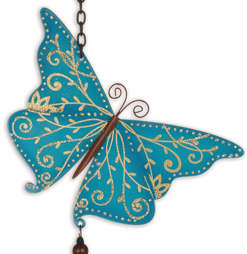 Close-up of blue butterfly wind chime with gold filigree-style accents and metal details.