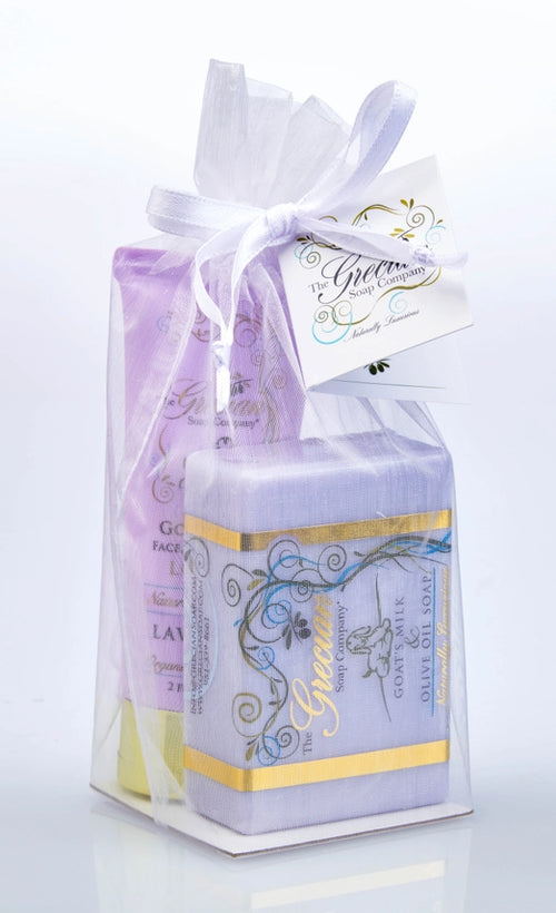 Lavender Goat Milk 2-piece gift set in a white organza bag featuring a large handmade soap bar and lotion tube with gold leaf accents and botanical illustrations.