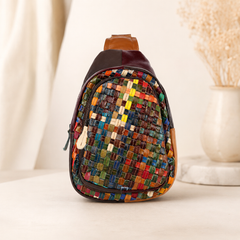 Multicolored woven sling bag on a light background
