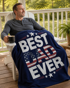 Dad relaxing on a front porch with coffee while using the Best Dad Ever navy patriotic flannel blanket.