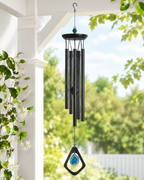 Mystic Blue Agate wind chime hanging on a peaceful porch with greenery and soft natural light.