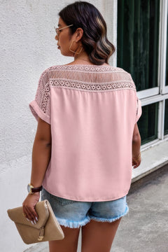 Back view of blouse showing full lace design in vibrant pink with relaxed silhouette