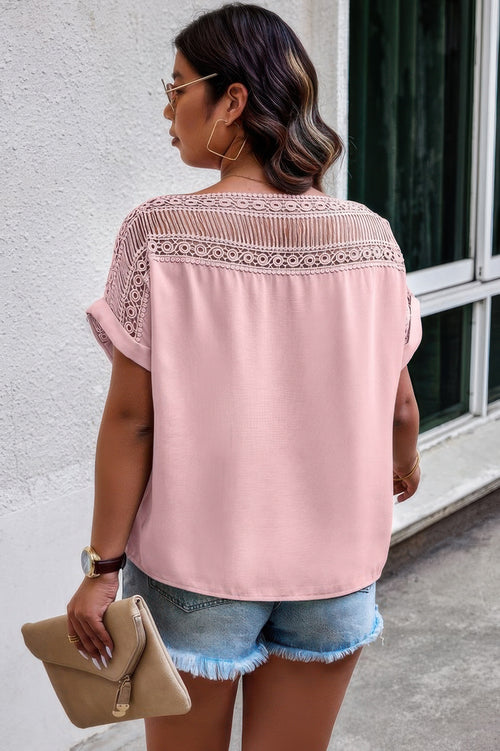 Back view of blouse showing full lace design in vibrant pink with relaxed silhouette