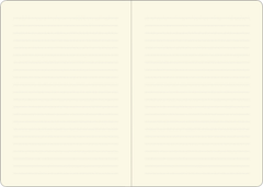 Solid light beige colored pages of a blank journal.