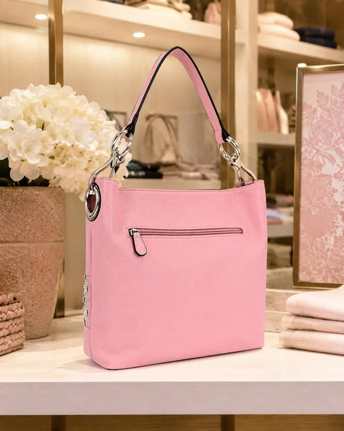 Back view of pink hobo handbag with zip pocket
