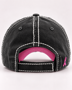 Back view of distressed black pink ribbon baseball cap with adjustable closure