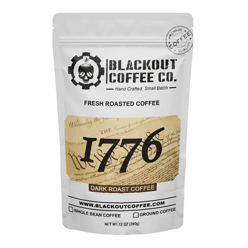 White coffee bag with Blackout Coffee Co. branding and '1776' dark roast coffee label.