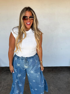 Close-up of the elastic tie waist with denim strings and panel stitch details on the Oh My Stars pants.