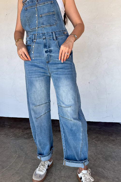 Close-up of the front bib and darted knee details on the Blakeley denim overalls.