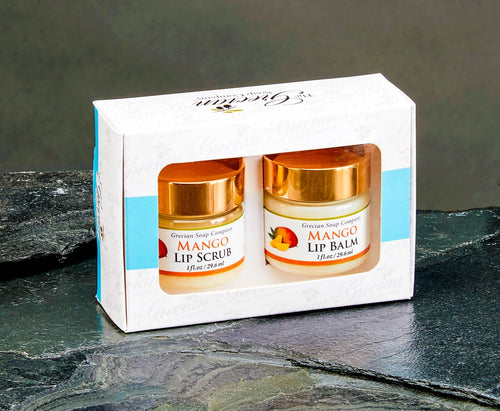 Set of Mango Lip Scrub and Lip Balm in a branded box on a dark surface.