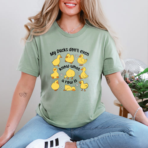 My Ducks Don’t Know What a Row Is Tee – Funny Graphic T-Shirt (S–4XL) – Custom Unisex Fit – Pink, White, Sage