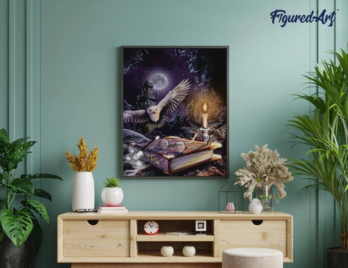 Framed Magic Owl diamond painting displayed on a wall above a light wood console table with plants and home decor