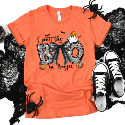 Boo in Boujee Halloween graphic tee in heather orange, flat lay with black lace and sneakers.