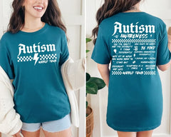 Teal t-shirt with 'Autism Awareness World Tour' text and graphics worn by a person.