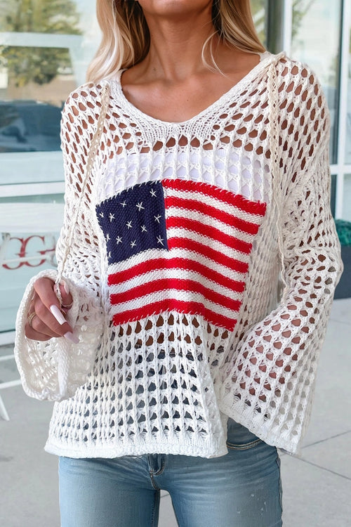 Front view of an American flag crochet knit hoodie styled with jeans, featuring an open white knit design and red, white, and blue flag detail.