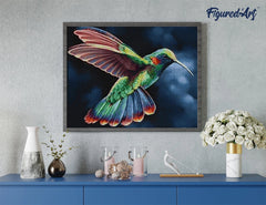 Framed hummingbird diamond painting displayed above a blue console table with home decor accents
