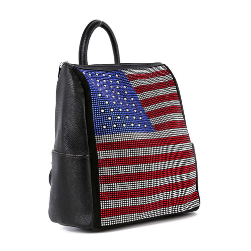 Angled side view of a black rhinestone flag backpack with top handle and side slip pocket.