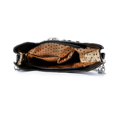 Black handbag with a patterned interior on a white background