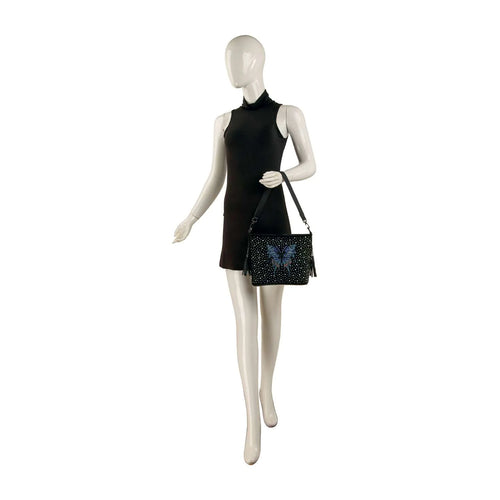 Mannequin wearing a black dress and holding a black handbag with butterfly design on a white background