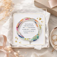 Colorful beaded bracelet with inspirational message card on a soft background
