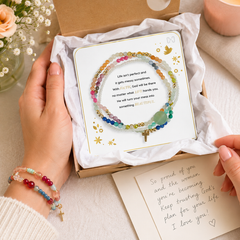 Messy Life Charm Bracelet displayed in an open gift box with tissue paper, a handwritten encouragement note, flowers, and a cozy faith-filled gift presentation.
