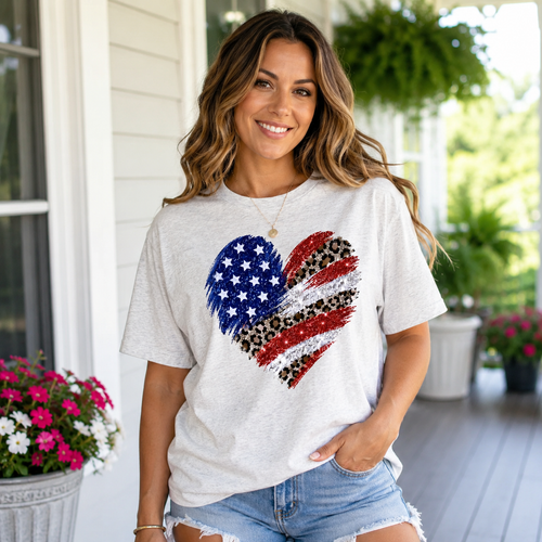 Ash Flag Heart Graphic Tee with patriotic American flag heart and leopard print detail on model.