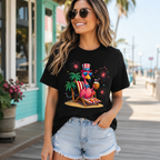 Black Beach Flamingo Graphic Tee with patriotic flamingo lounging on a beach chair with fireworks on model.