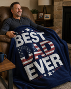 Dad sitting in a cozy living room recliner with the Best Dad Ever navy patriotic flannel blanket across his lap.