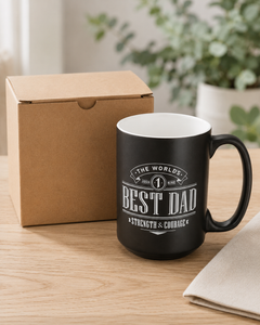 Black Best Dad coffee mug displayed beside a plain tuck-top Kraft cardboard gift box.