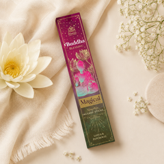 A box of Buddha Blessing Magical Sparkle Incense Sticks, styled in a flat-lay arrangement with a white lotus flower, cream fabric, and baby's breath on a warm beige background.