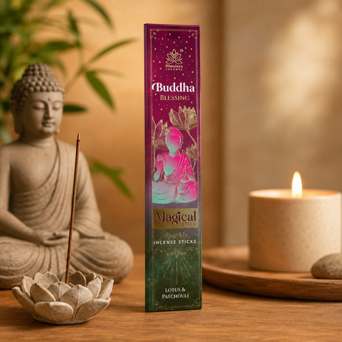 A box of Buddha Blessing Magical Sparkle Incense Sticks stands on a wooden surface between a seated Buddha statue and a lit candle, with warm ambient lighting and soft background decor.