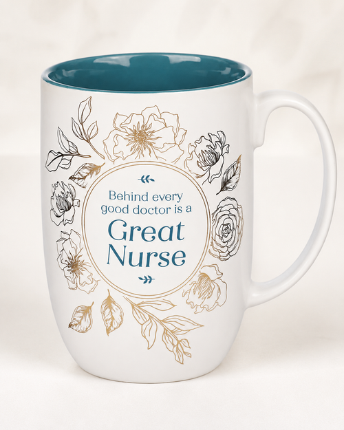 White ceramic Great Nurse mug with glossy teal interior, teal lettering, and delicate gold floral design.