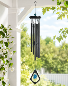 Mystic Blue Agate wind chime hanging on a peaceful porch with greenery and soft natural light.