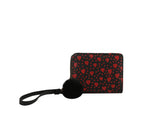 Black pouch with red heart pattern and black pom-pom on a white background