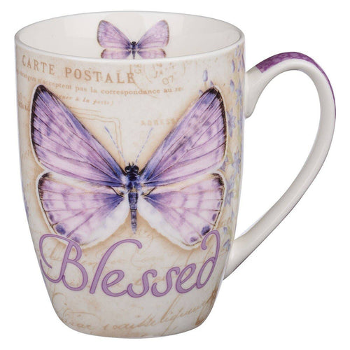 Mug with butterfly design and 'Blessed' text on a white background