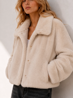 Beige faux fur collar closeup with snap button detail