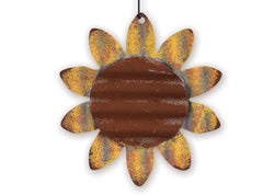 Decorative metal sunflower ornament with rusted brown center and yellow petals on a white background