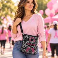 Breast cancer awareness rhinestone crossbody sling worn at a pink ribbon awareness walk