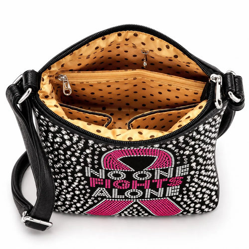 Interior of breast cancer awareness rhinestone crossbody sling showing lined pockets