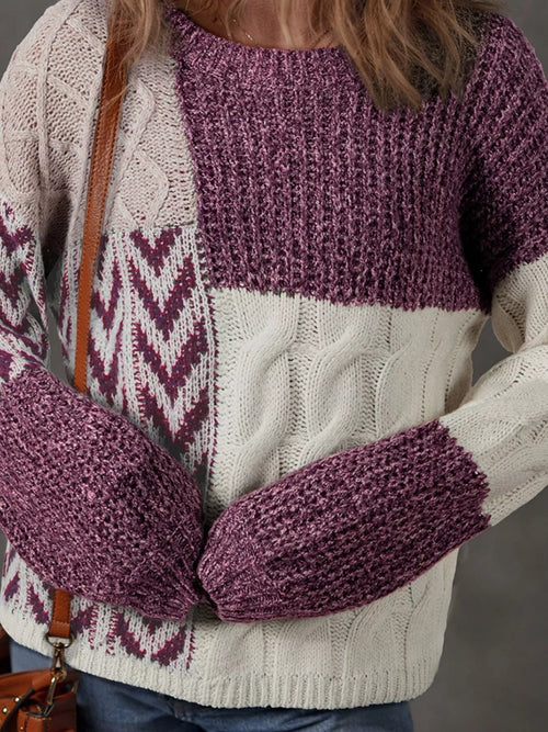 Person wearing a purple and white patterned sweater with matching mittens.