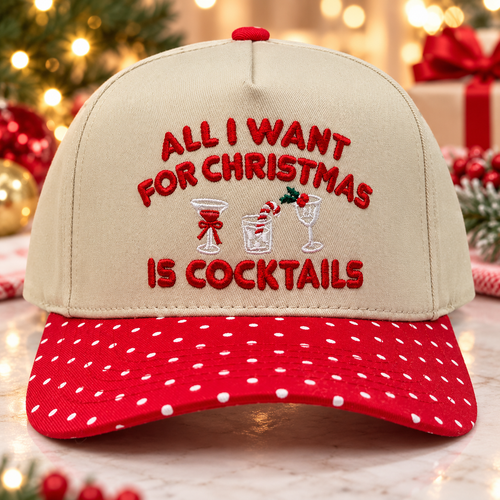 Two-tone beige and red Christmas snapback cap embroidered with All I Want For Christmas Is Cocktails