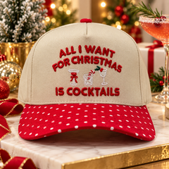 All I Want For Christmas Is Cocktails embroidered snapback cap styled with festive holiday decor