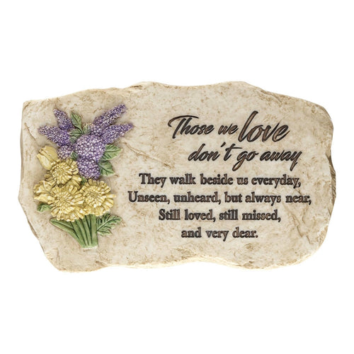 Cream-colored resin memorial wall plaque shaped like a garden stone featuring purple and yellow sculpted flowers and an engraved bereavement poem.